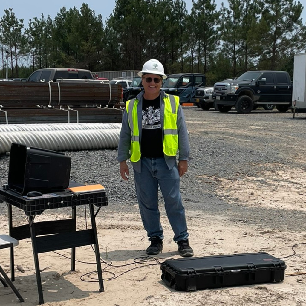Andrew Vandekop of Well Water Finders locating groundwater at solar farm.